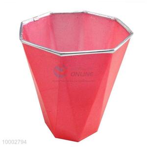 Red plastic trash <em>can</em>
